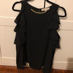 Michael Kor’s black open shoulder shirt